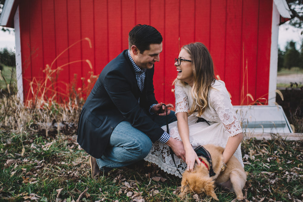 Columbus engaged couple with their puppy at mr tree farm