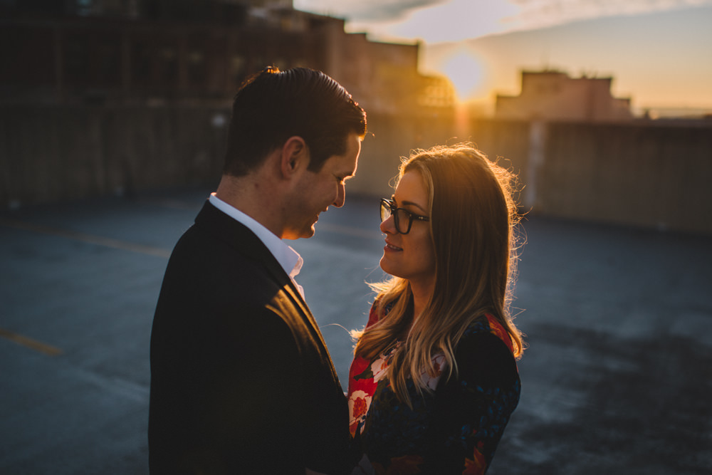 columbus engaged couple looking intently at each other at sunset