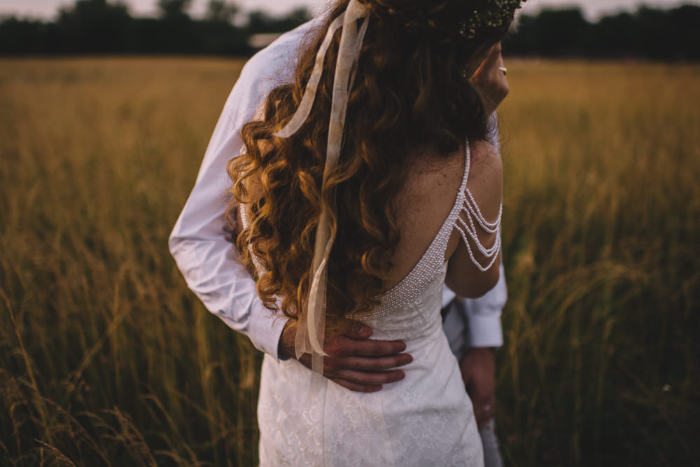 sunset wedding photography at old blue rooster wedding with a flower crown