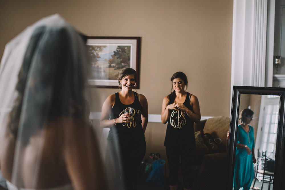 bridesmaids laughing at Wedgewood Country Club wedding photography in Columbus