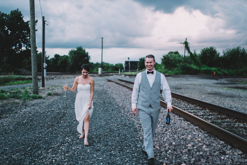bride and groom walking together during sunset in columbus