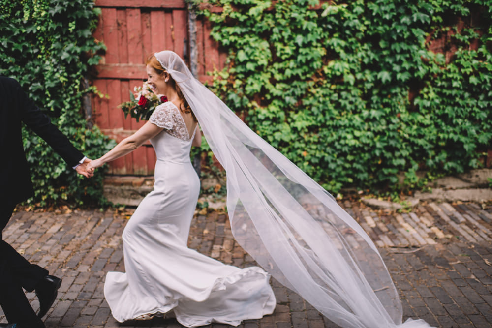 columbus ohio bride running through German Village