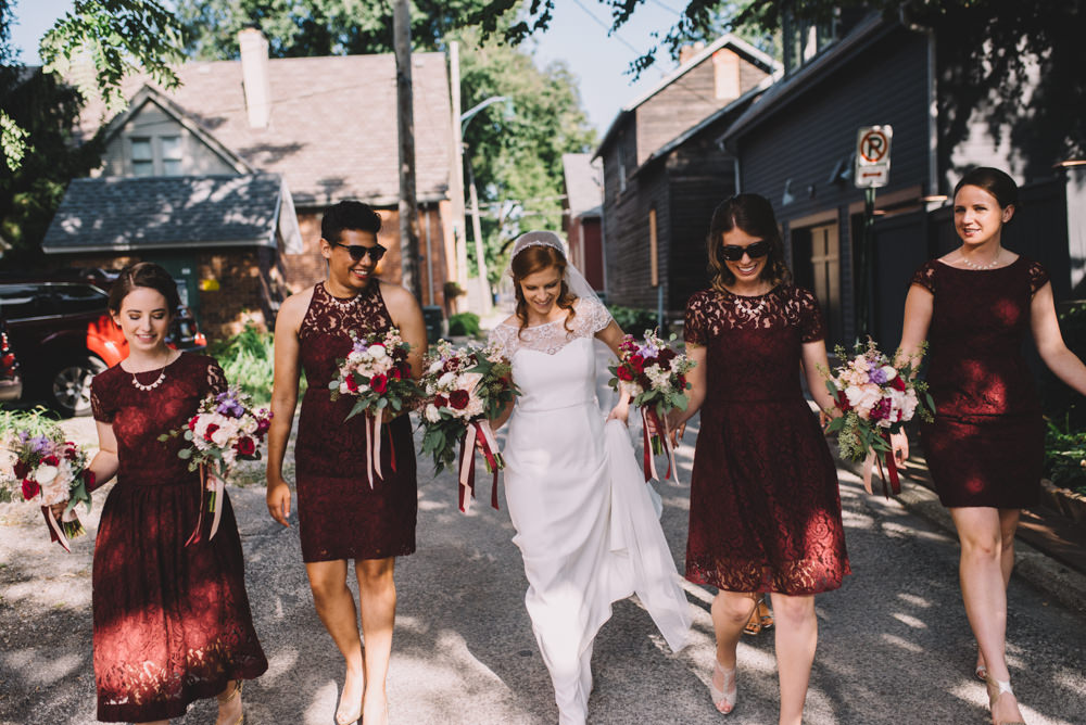 Columbus bride walking through the streets with her bridesmaids