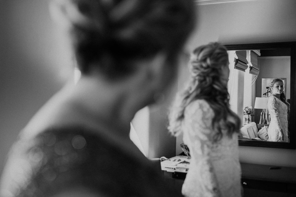 bride's mom looking over the bride on her wedding day in columbus ohio