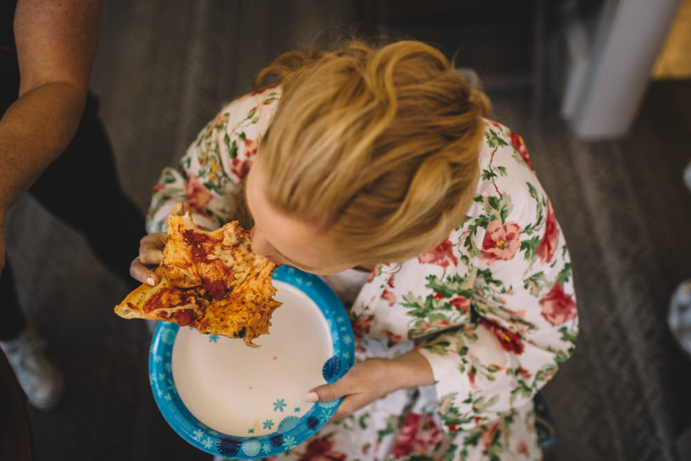 bride eating pizza in columbus ohio wedding